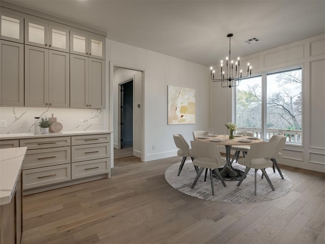 dining room featuring a chandelier and hardwood / wood-style flooring