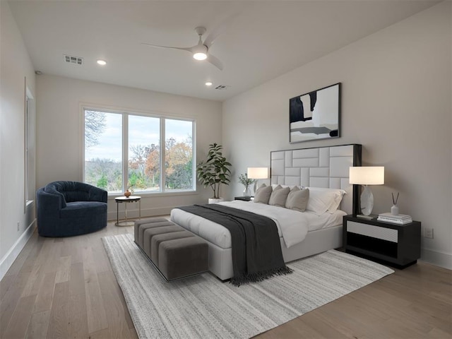 bedroom featuring hardwood / wood-style floors and ceiling fan