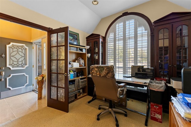 tiled office space featuring vaulted ceiling and french doors