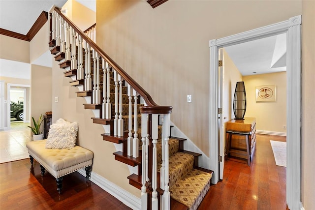 stairway with hardwood / wood-style flooring