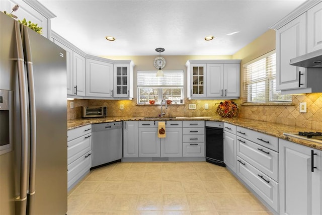 kitchen featuring a wealth of natural light, white cabinetry, and stainless steel appliances