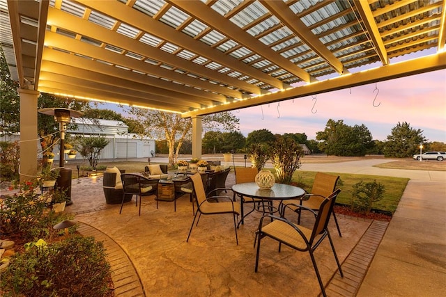 patio terrace at dusk with a pergola