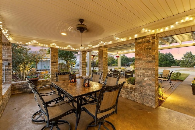 view of patio terrace at dusk