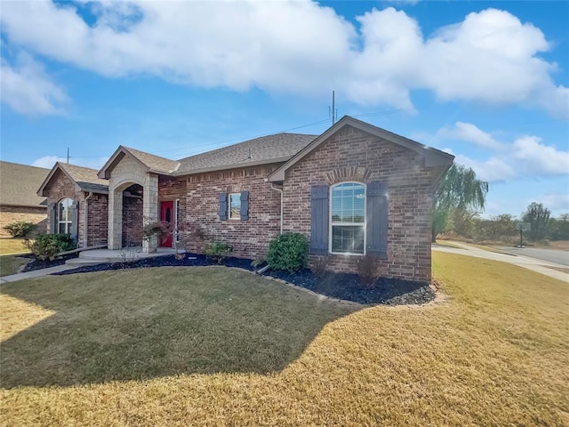 ranch-style house with a front lawn