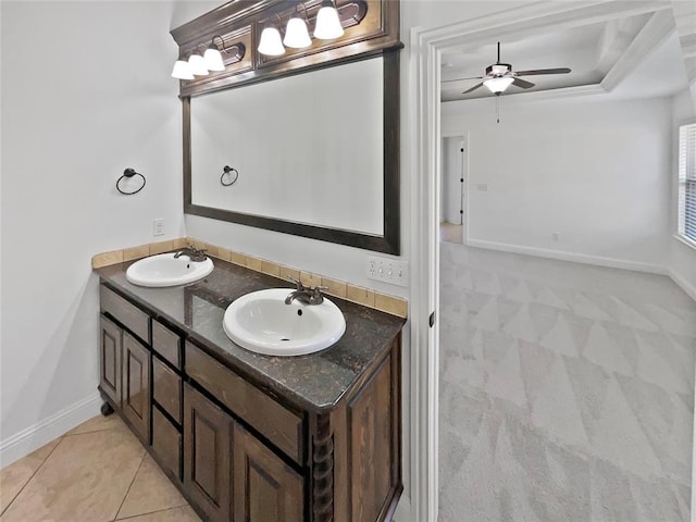 bathroom featuring tile patterned flooring, vanity, and ceiling fan