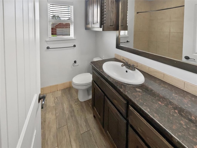 bathroom featuring hardwood / wood-style floors, vanity, and toilet