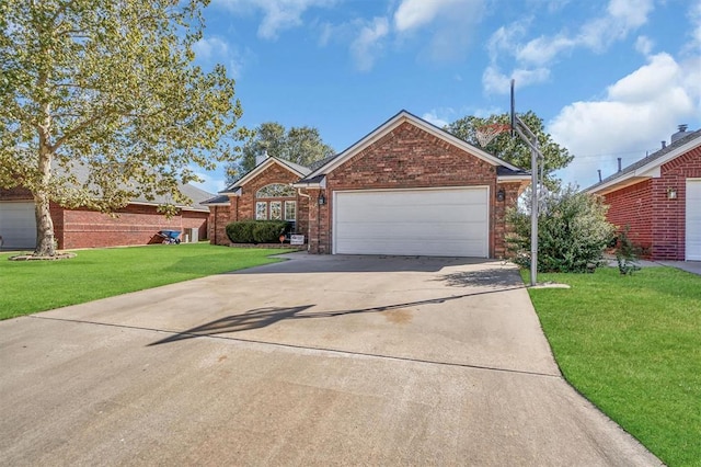 view of front facade with a garage and a front lawn