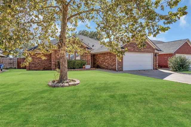 view of front of house featuring a front yard and a garage