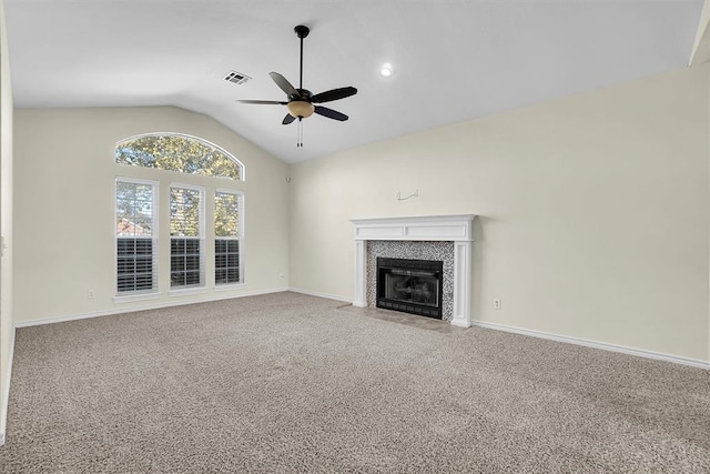 unfurnished living room featuring carpet flooring, ceiling fan, and vaulted ceiling