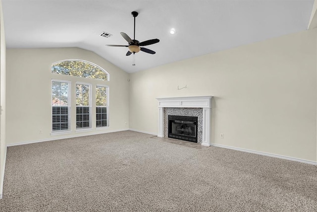 516 S Quail Run, Altus, OK 73521 - unfurnished living room with ceiling fan, vaulted ceiling, a tile fireplace, and carpet
