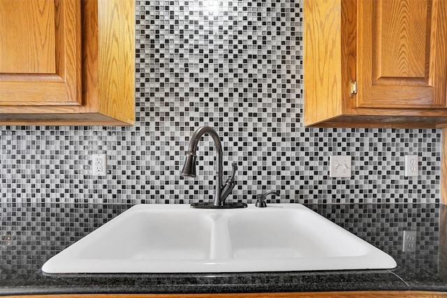 interior details with decorative backsplash and sink