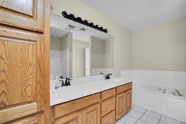516 S Quail Run, Altus, OK 73521 - bathroom featuring tile patterned flooring, a bath, and double vanity