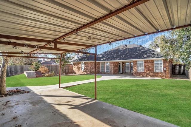 516 S Quail Run, Altus, OK 73521 - fenced backyard featuring a patio area