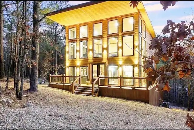 view of front of home featuring a wooden deck