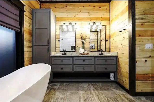 bathroom with wood walls, vanity, and a bath