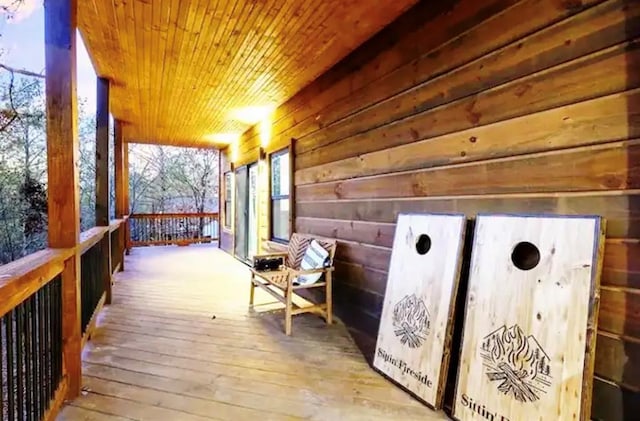 wooden terrace featuring a porch