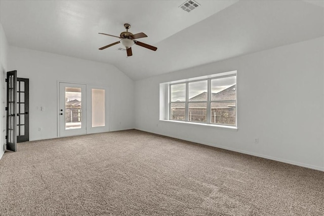 spare room with ceiling fan, carpet floors, and lofted ceiling