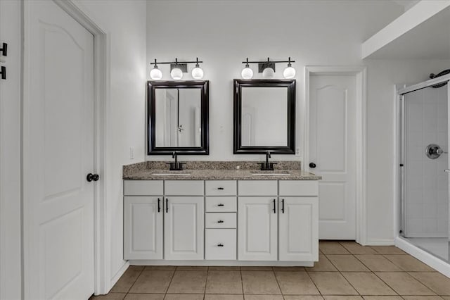 bathroom with vanity, walk in shower, and tile patterned floors