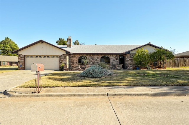 single story home with a garage and a front yard