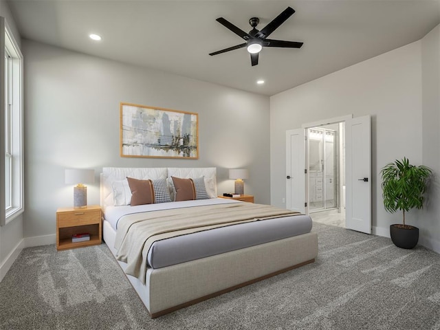 bedroom featuring ceiling fan, ensuite bath, and carpet floors