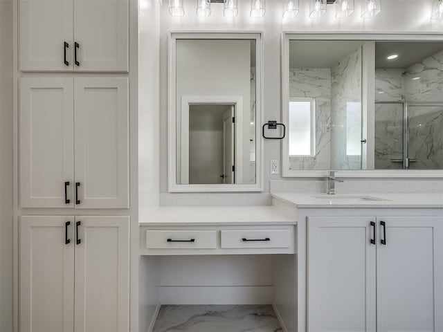 bathroom with vanity and an enclosed shower