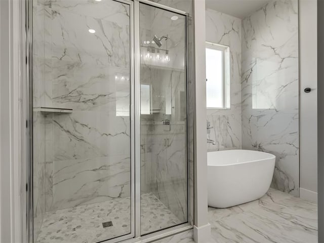 bathroom with separate shower and tub