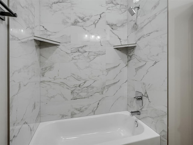 bathroom featuring tiled shower / bath combo