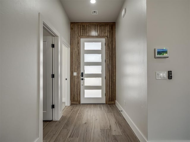 entryway with light hardwood / wood-style flooring