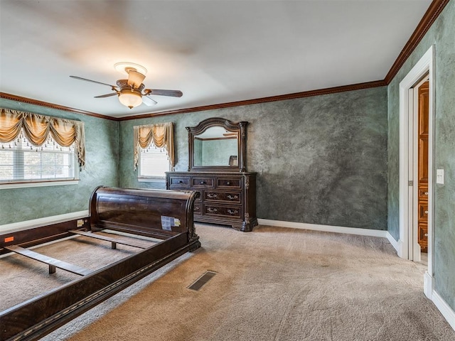 bedroom featuring ceiling fan, carpet, and ornamental molding