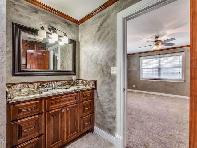 bathroom with vanity, crown molding, and ceiling fan