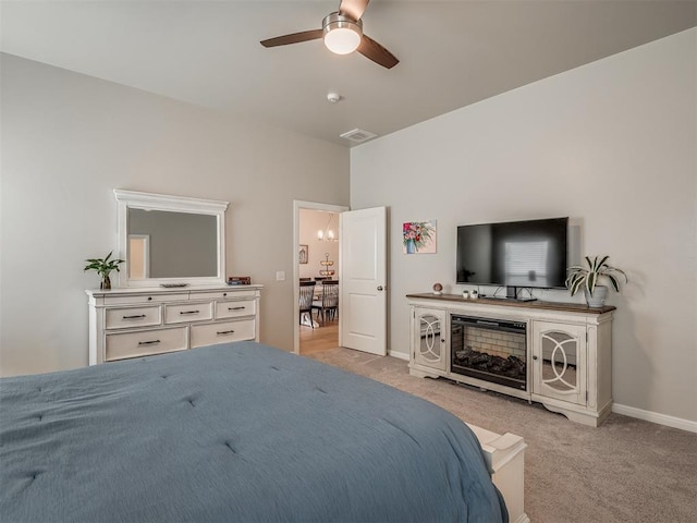 bedroom featuring light carpet and ceiling fan