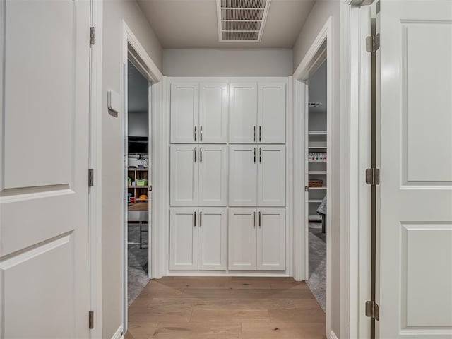 hall featuring light hardwood / wood-style flooring