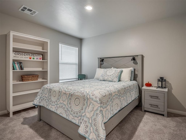 bedroom with light carpet