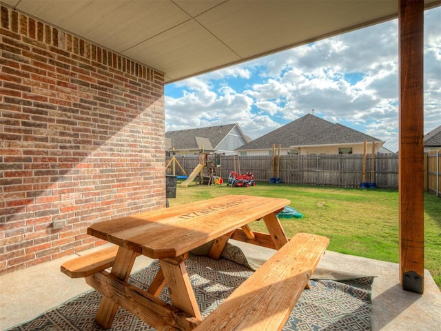 view of patio featuring a playground