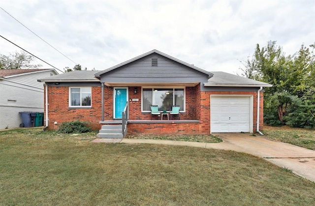 single story home featuring a front lawn and a garage