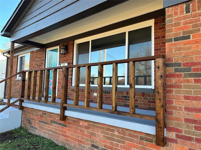 exterior space featuring brick siding