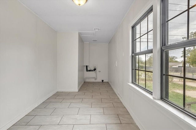 hallway featuring light tile patterned floors