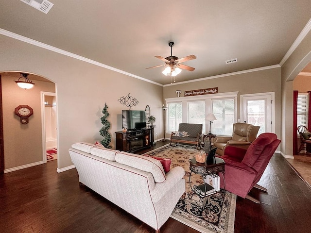 living room with ceiling fan, dark hardwood / wood-style flooring, and crown molding