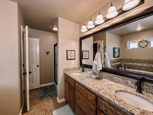 bathroom with vanity, tile patterned floors, and independent shower and bath