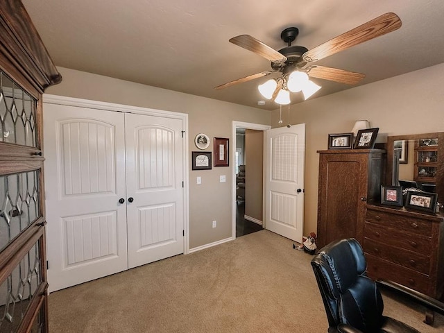 office space featuring ceiling fan and carpet floors