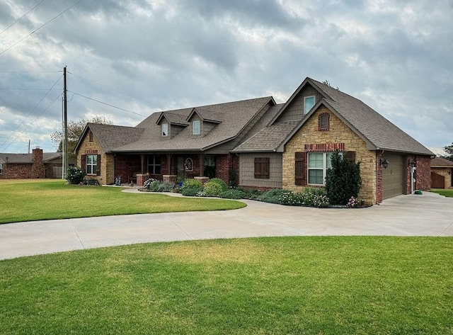 view of front facade with a garage and a front lawn