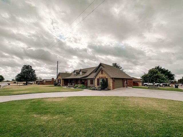 view of front of house with a front yard and a garage