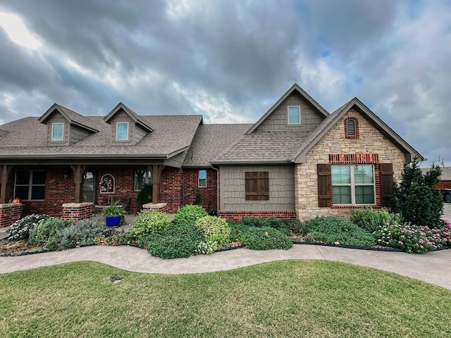 craftsman-style house with a front lawn