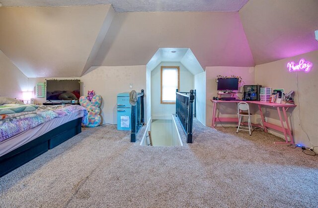 bedroom with carpet flooring and vaulted ceiling