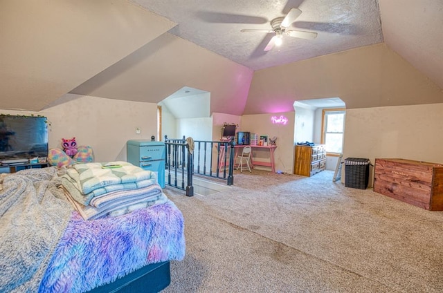 bedroom featuring a textured ceiling, carpet floors, vaulted ceiling, and ceiling fan