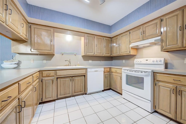 kitchen with sink, light tile patterned floors, and white appliances