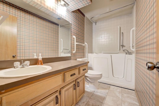 full bathroom featuring vanity, tile patterned floors,  shower combination, and toilet