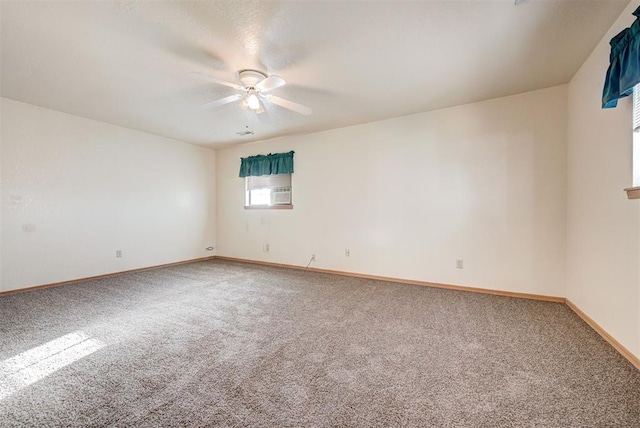 spare room featuring carpet flooring and ceiling fan