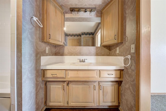 bathroom with vanity and walk in shower