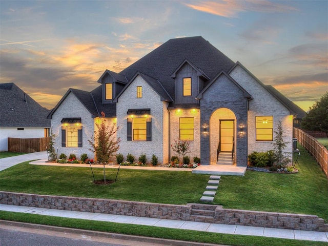 view of front of property with a lawn